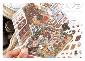 Close-up of cute cartoon coffee house stickers with bears and cats for journaling