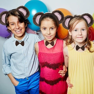 Close-up of plush animal ears headband and bow tie set for party performance