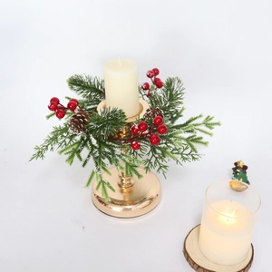 Golden Christmas candle holder ring with frosted pine needles, red berries and pinecones