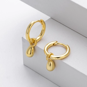 Minimalist S925 sterling silver gold plated teardrop earrings on white display