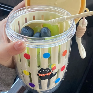 Portable double-layer fruit salad cup with strainer, yellow lid, fork, and black cat motif