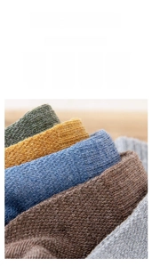 Detailed macro view of high-quality ribbed knit cotton socks in five classic earth tones