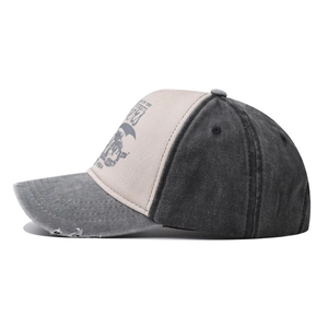 Detailed side view of washed vintage baseball cap with tri-color panels and distressed brim