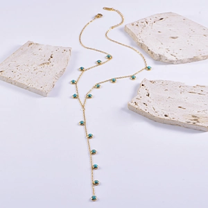 Exquisite gold Y-shaped necklace with turquoise stones and heart cross pendants