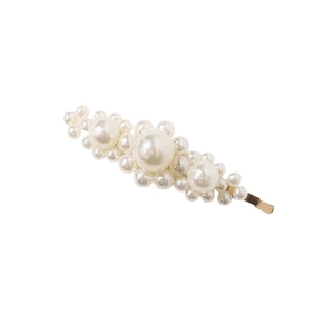 Minimalist clustered pearl hair clip with gold metal base on a clean white background