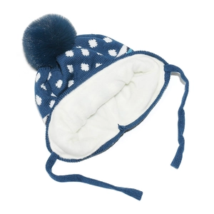 Detail of baby winter knit hat with soft fleece lining and fluffy faux fur pompom