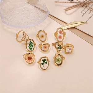 Preserved flower resin gold ring set with colorful dried botanical specimens inside
