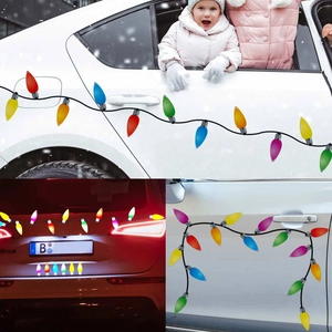 Close-up of colorful Christmas bulb magnetic stickers reflecting light on a white car body