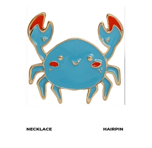 Detail of blue enamel cartoon crab brooch with gold trim for necklaces or hairpins