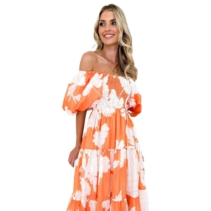 Elegant off-shoulder floral maxi dress with puff sleeves and tiered orange print design