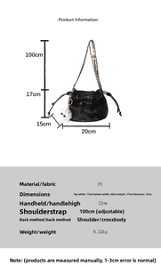 Size chart for black bucket bag with chain strap and plush cat charm detail