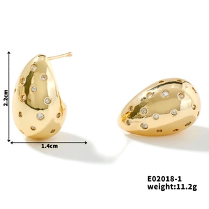 Detail view of french vintage gold teardrop earrings with dimensions and white zircons
