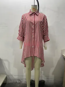 Detail of red and white striped shirt featuring asymmetric hem and button-down cuffs