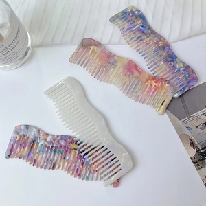 Chic wave-shaped acetate wide-tooth hair comb set in colorful textured marble patterns