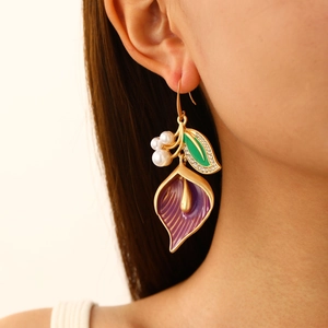 Elegant gold calla lily earrings with purple enamel flowers and white pearl accents