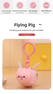 Close-up of pink flying pig keychain showing the durable ABS material and pull-string mechanism