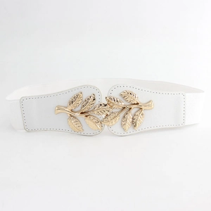 Detail of white elastic waist belt featuring a polished golden metal leaf buckle