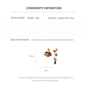 Size specifications for amber tassel earrings showing 11cm length and 19g weight