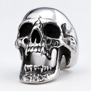 Macro detail of gothic skull ring with blacked accents and polished stainless steel finish