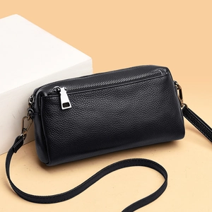 Classic black litchi grain leather crossbody bag for women with silver zipper detail