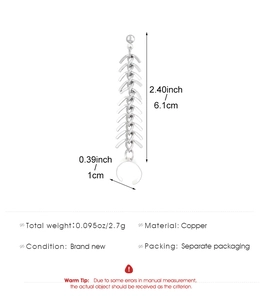 Détail des boucles d'oreilles arête de poisson en cuivre, longueur 6,1cm et poids 2,7g