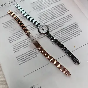 Detail of rose gold and silver chain wristwatches on magazine for fashion display