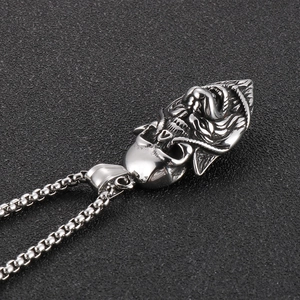 Detailed close-up of Gothic skull and snake pendant on a sturdy steel box chain