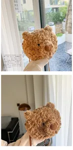 Detailed view of a cute brown plush bear-shaped crossbody bag with soft faux fur texture