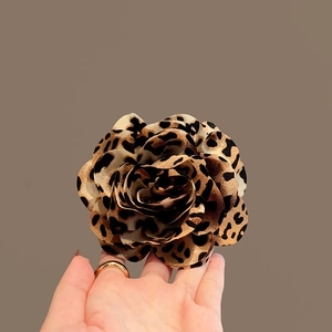 Retro acrylic leopard print flower hair claw clip with a 3D layered petal design