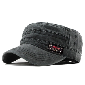 Detail of dark grey washed cotton flat top army cap with leather patch and metal eyelets