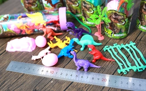 Detailed set of colorful plastic mini dinosaur figures with eggs, trees and fence accessories
