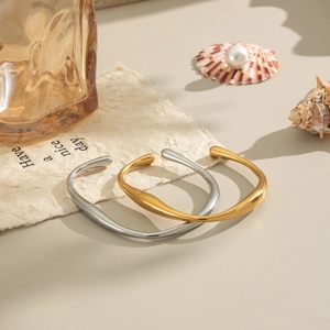Irregular wave-shaped stainless steel open cuff bracelets in polished gold and silver