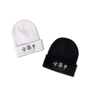 Winter knit beanie with three floral patterns and A Little More Kindness slogan