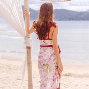 Rear view of a floral one-piece bikini set with a matching semi-transparent beach sarong
