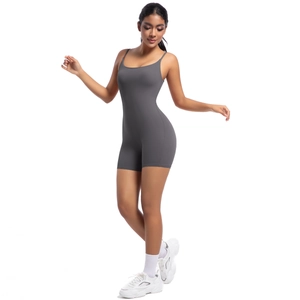 Close-up of grey yoga jumpsuit with thin straps and elastic fabric for fitness training