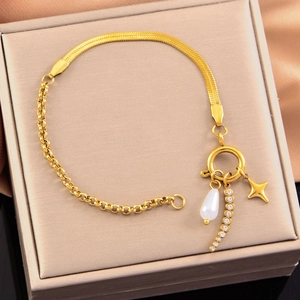 Gold stainless steel AB chain bracelet with pearl and star charms in a jewelry box