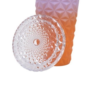 Detailed macro view of diamond textured pink and orange gradient plastic tumbler