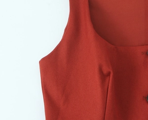 Detailed macro view of dark red twill fabric texture and professional stitching seams