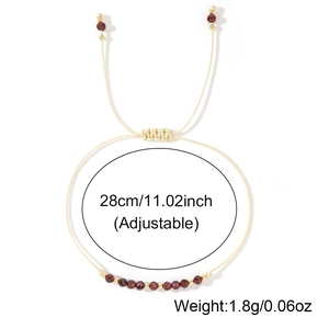 Detail of adjustable handmade cord bracelet with brownish red semi-precious beads