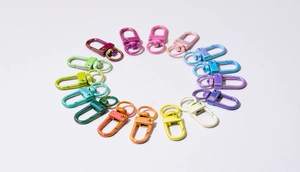 Macro view of colorful electroplated spring gate rings and alloy lobster claw clasps