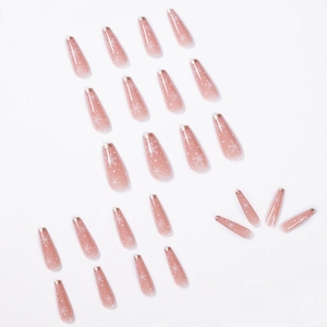 Long ballet nude ombré press-on nails with white snowflakes and French gold tips