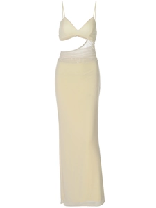 Elegant off-white cutout maxi dress with thin spaghetti straps for a sleek summer look