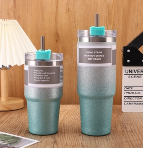 Detail of 30oz and 20oz stainless steel glitter tumblers with BPA-free lids and metal straws