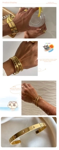 Detail of 18k gold plated titanium bangles with micro-set zircon stars in layered style