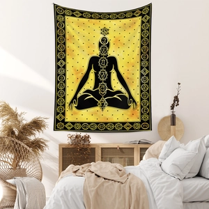 Detail of bohemian yoga tapestry with meditation silhouette and seven chakra symbols