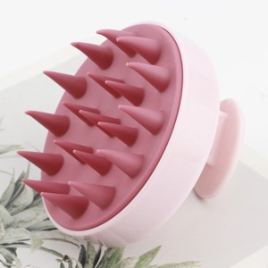 Ergonomic pink silicone scalp massage brush with 19 soft bristles for hair washing