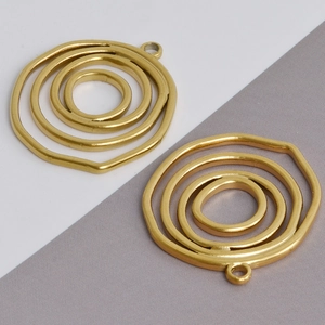 Detailed view of gold irregular multilayer concentric circle charms for DIY jewelry making