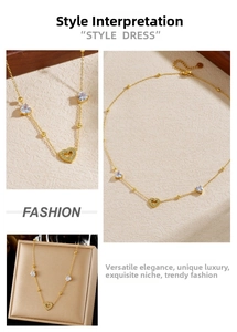 Detailed view of gold heart pendant necklace with blue stones and premium packaging