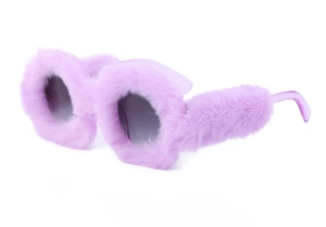 Detail of round sunglasses featuring fluffy purple faux fur trim and grey lenses