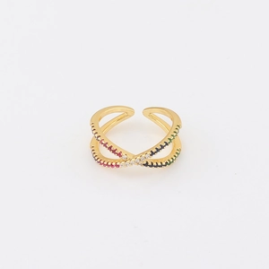 Top view of adjustable gold crossover ring with colorful zircon stones on white background
